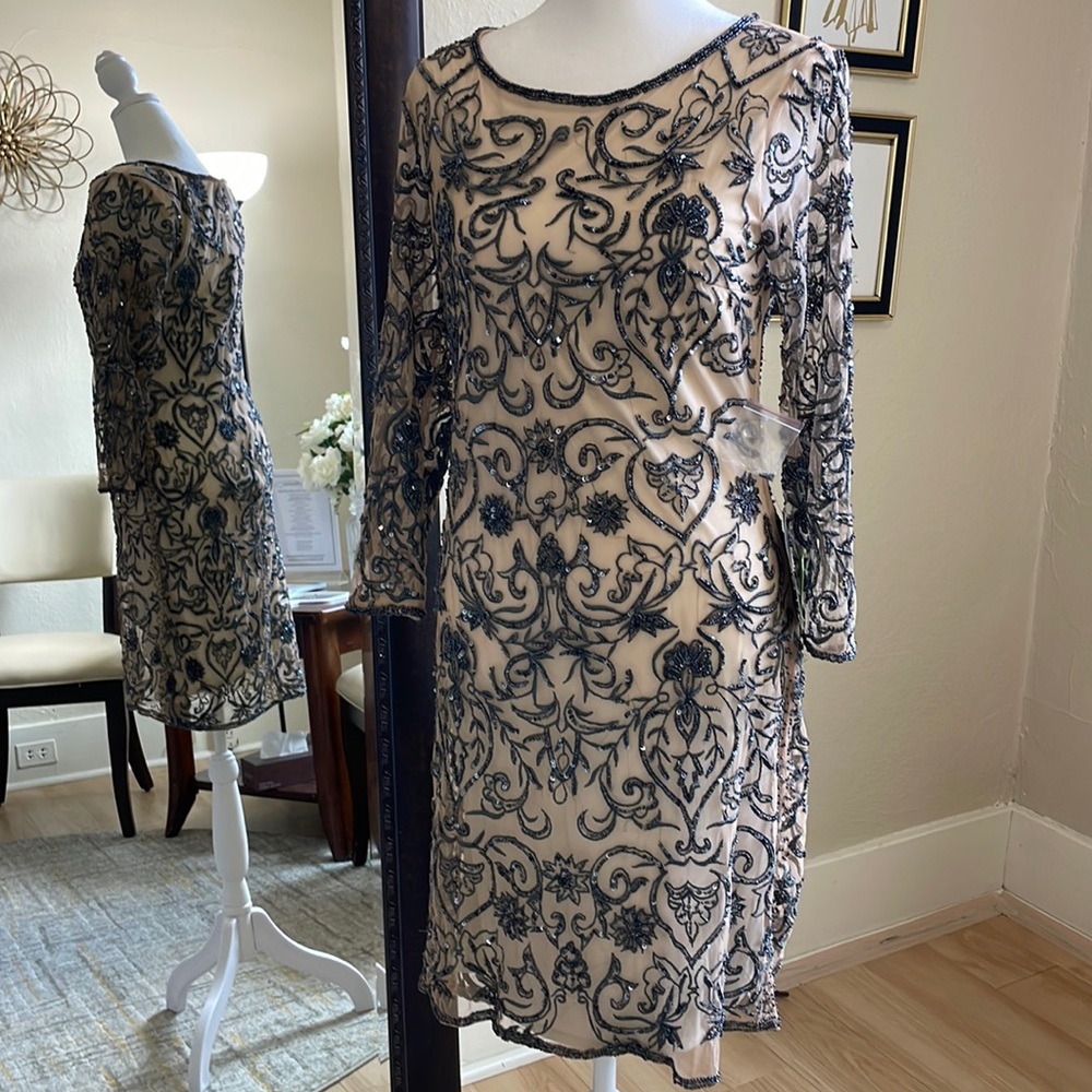 Size 8 nude with a slate colored design cocktail dress by Pissaro Nights NWT